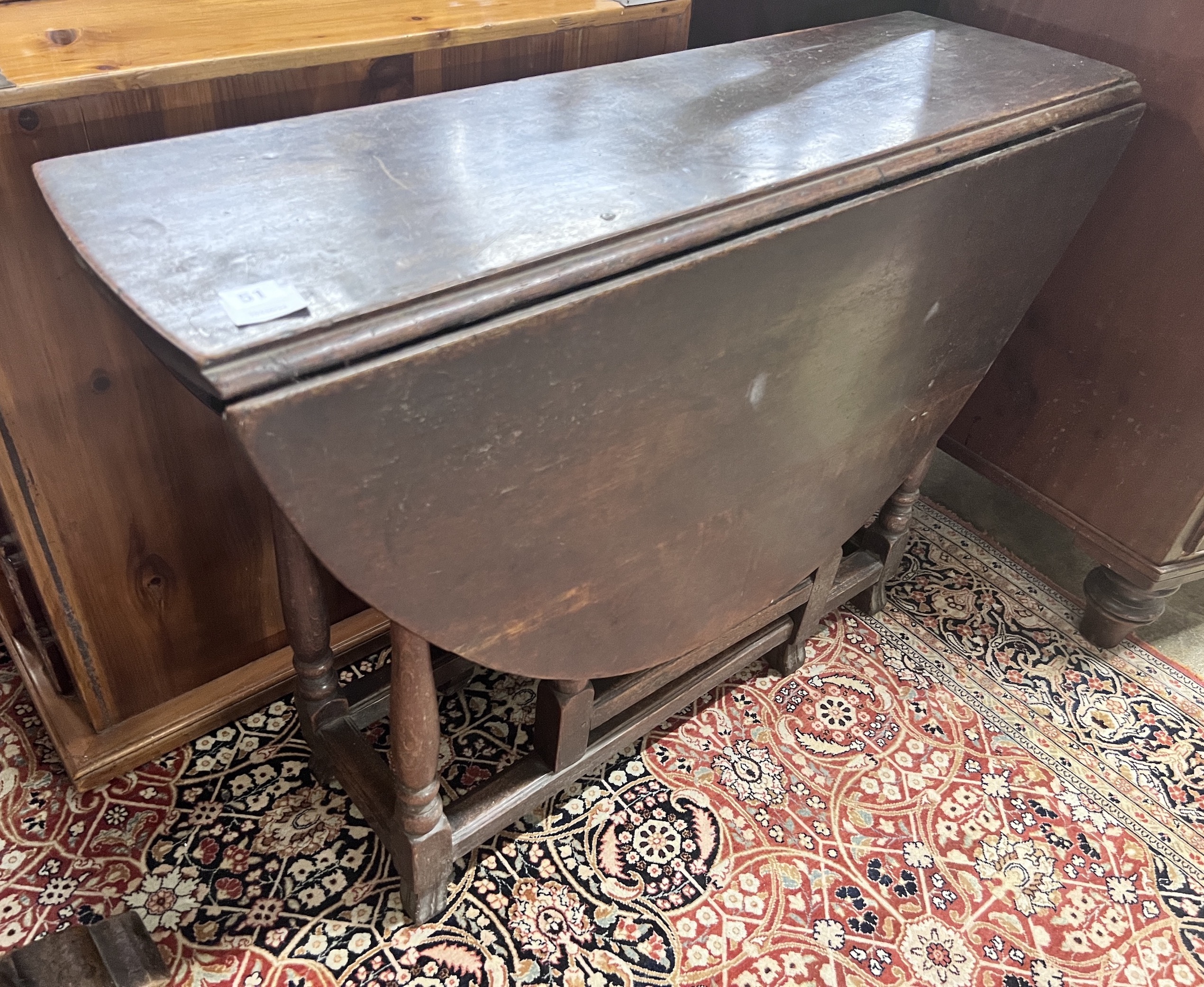 A small 18th century oak gateleg table, width 97cm, depth 32cm, height 70cm